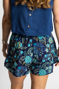 Sophie wearing the S/M Navy floral Summer Solstice Shorts with flowy relaxed silhouette