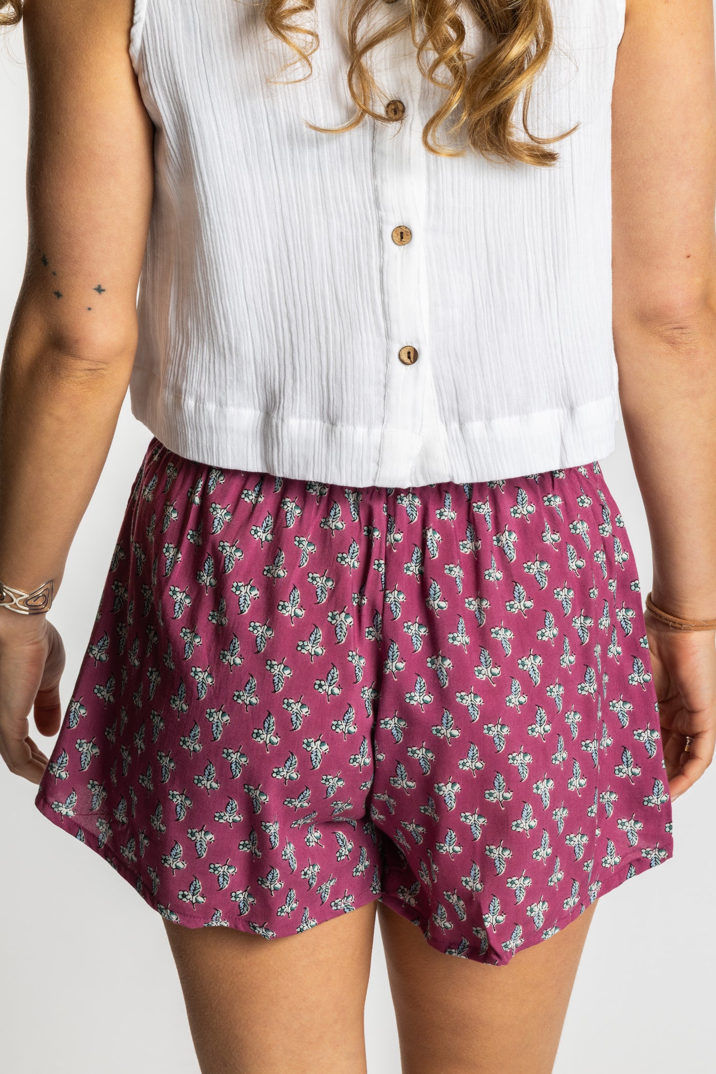 Sophie wearing the S/M sangria pink floral Summer Solstice Shorts with flowy relaxed silhouette