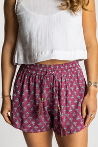 Sophie wearing the S/M sangria pink floral Summer Solstice Shorts with flowy relaxed silhouette