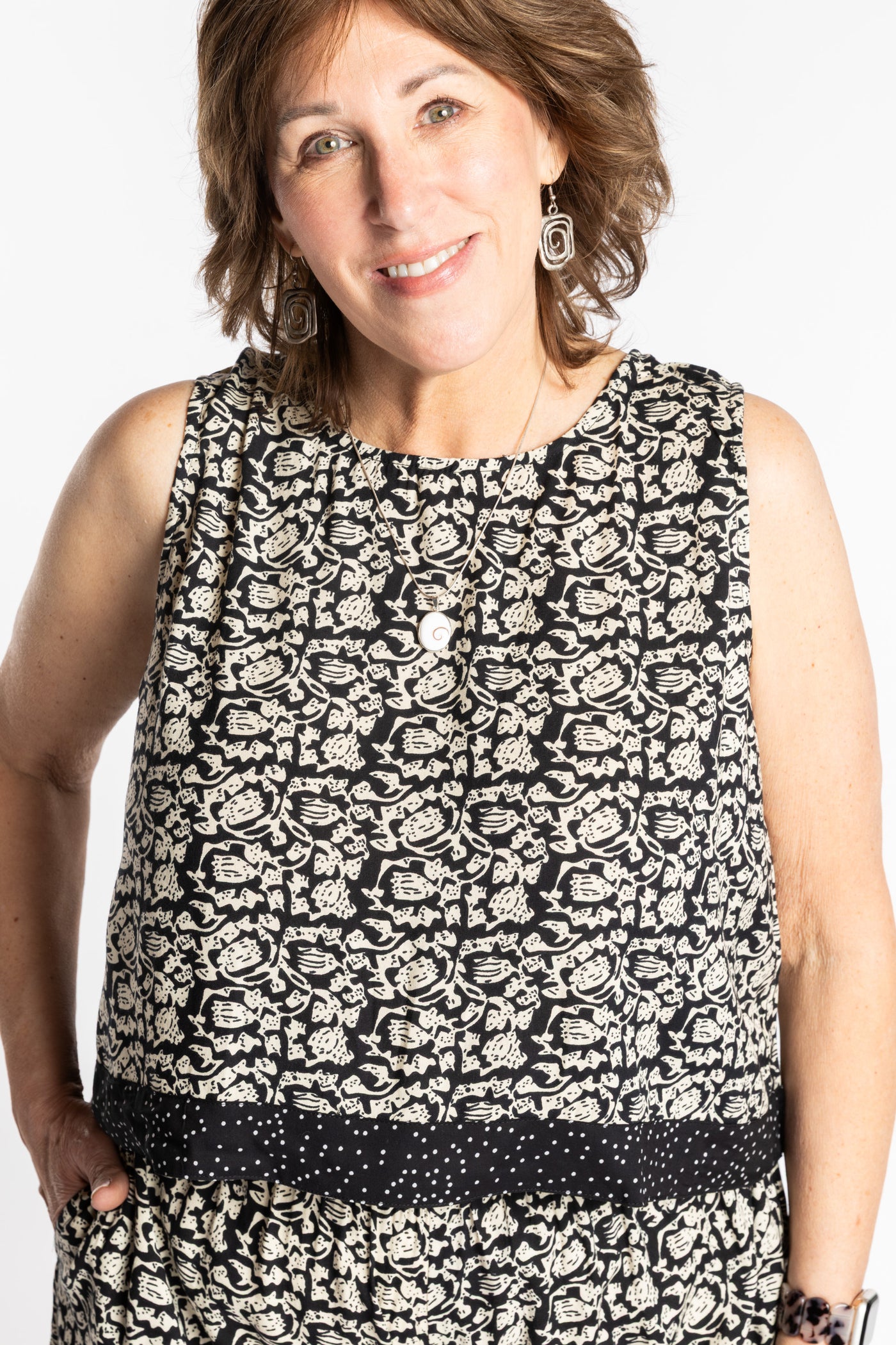 Betty wearing size L/XL Sahana Contrast Hem Sleeveless Top in Black Primrose floral print flowy boho sleeveless top