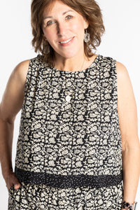 Betty wearing size L/XL Sahana Contrast Hem Sleeveless Top in Black Primrose floral print flowy boho sleeveless top
