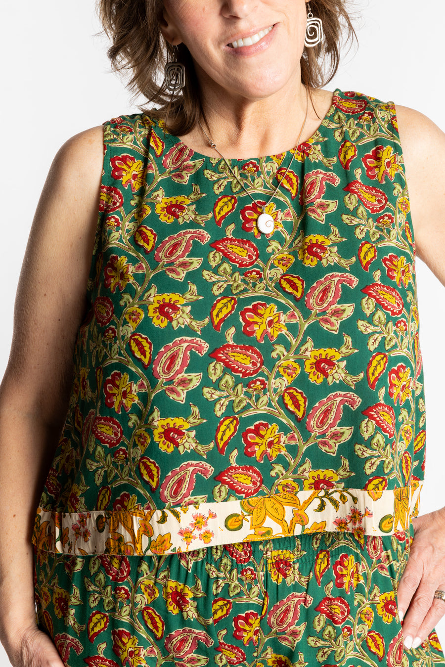 Betty wearing size L/XL Sahana Contrast Hem Sleeveless Top in Forest Green floral print flowy boho sleeveless top