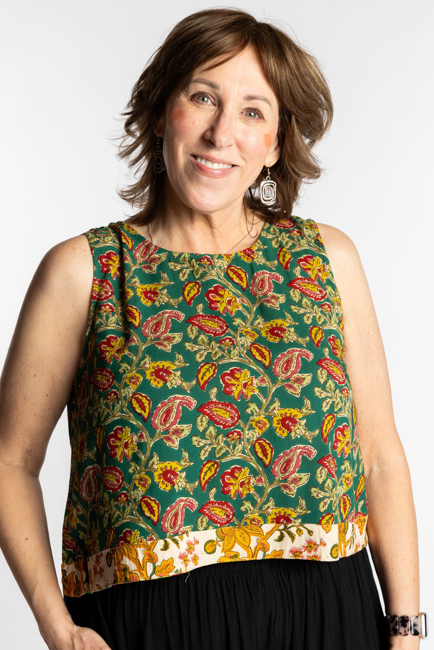 Betty wearing size L/XL Sahana Contrast Hem Sleeveless Top in Forest Green floral print flowy boho sleeveless top