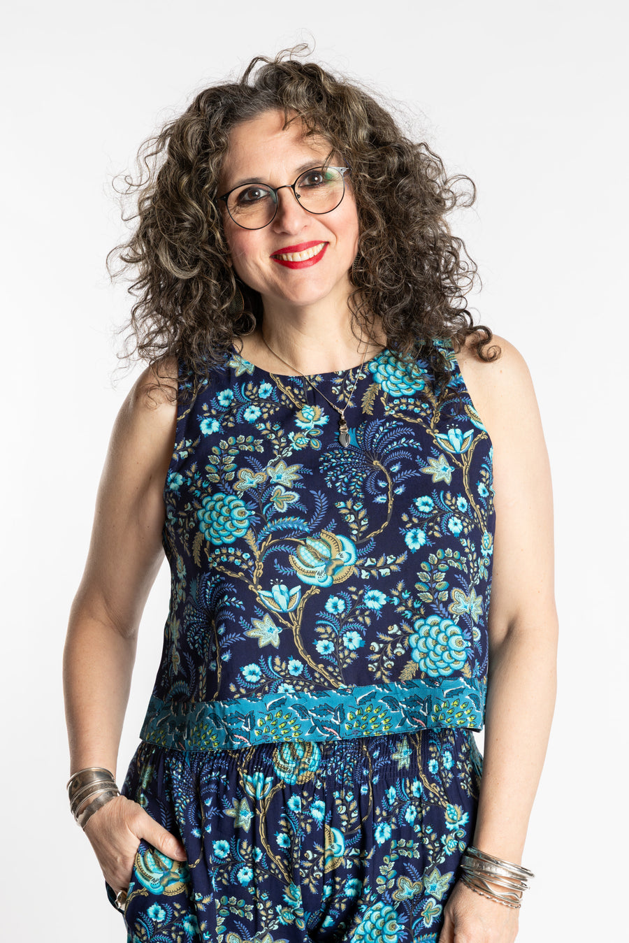 Susan wearing size M/L Sahana Contrast Hem Sleeveless Top in Navy blue floral print flowy boho sleeveless top