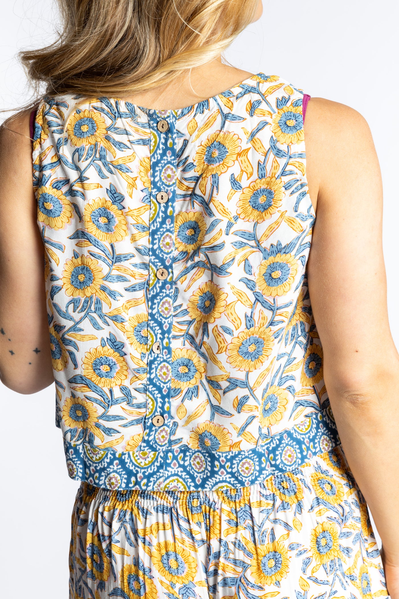 Sophie wearing size S/M Sahana Contrast Hem Sleeveless Top in Sunflower floral print flowy boho sleeveless top