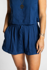 Sophie wearing Mel Milaana Cotton Drawstring Shorts in navy with matching navy Sahana Sleeveless Cotton Top, one size
