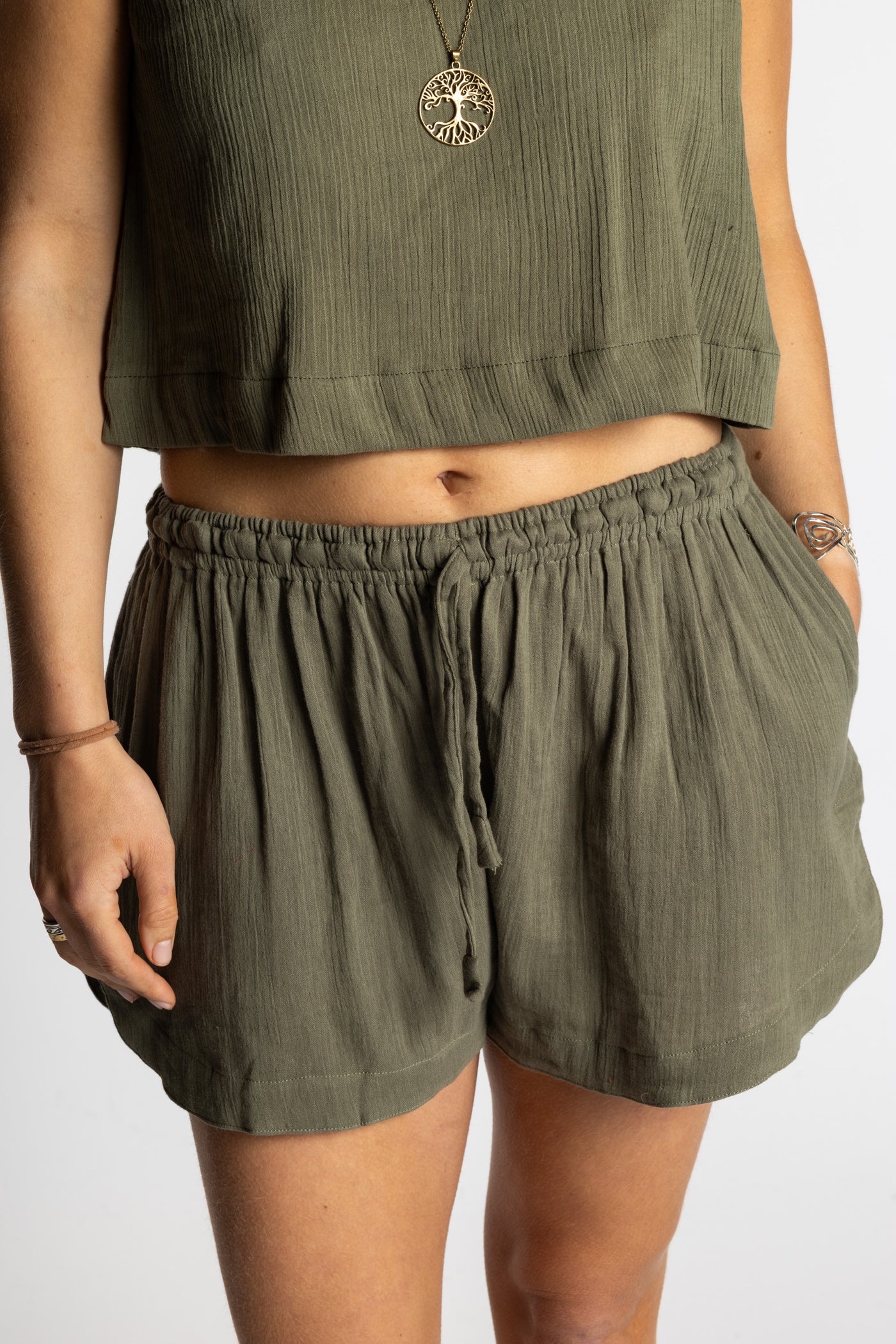 Sophie wearing Mel Milaana Cotton Drawstring Shorts in olive with matching olive Sahana Sleeveless Cotton Top, one size