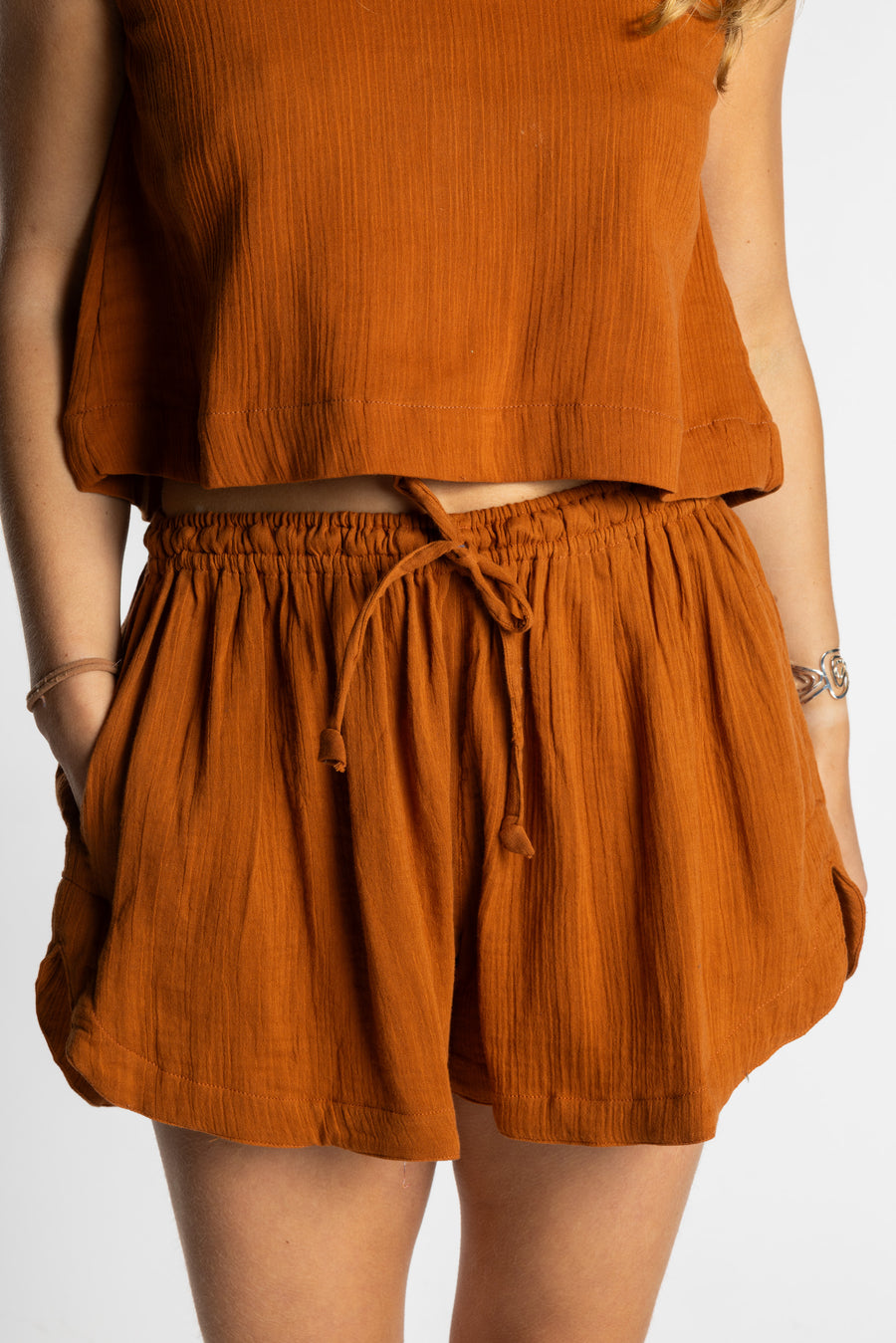 Sophie wearing Mel Milaana Cotton Drawstring Shorts in rust with matching rust Sahana Sleeveless Cotton Top, one size