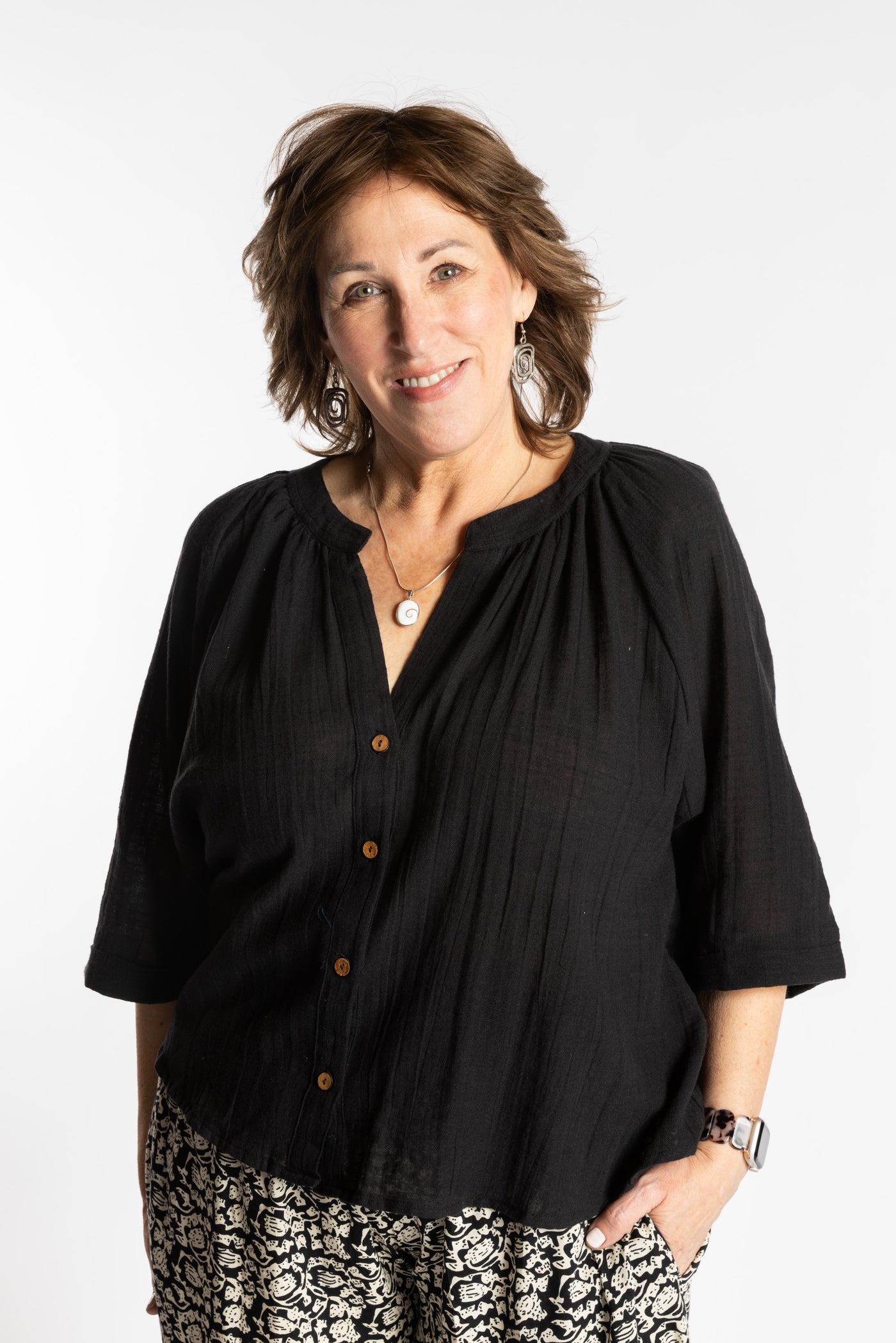 Betty is wearing the L/XL black flowy boho cotton top
