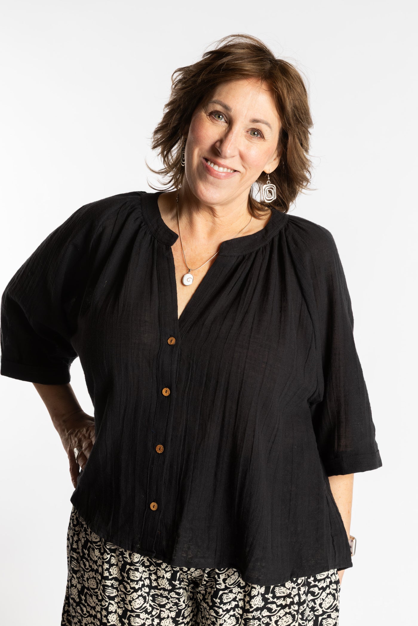 Betty is wearing the L/XL black flowy boho cotton top