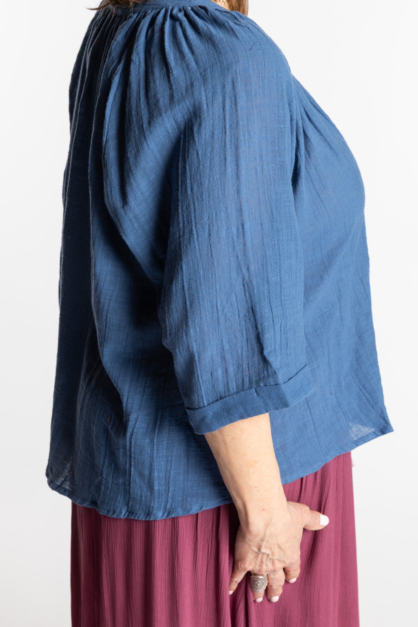 Betty is wearing the L/XL blue flowy boho cotton top