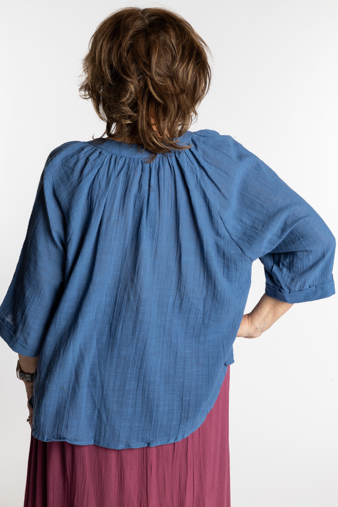 Betty is wearing the L/XL blue flowy boho cotton top