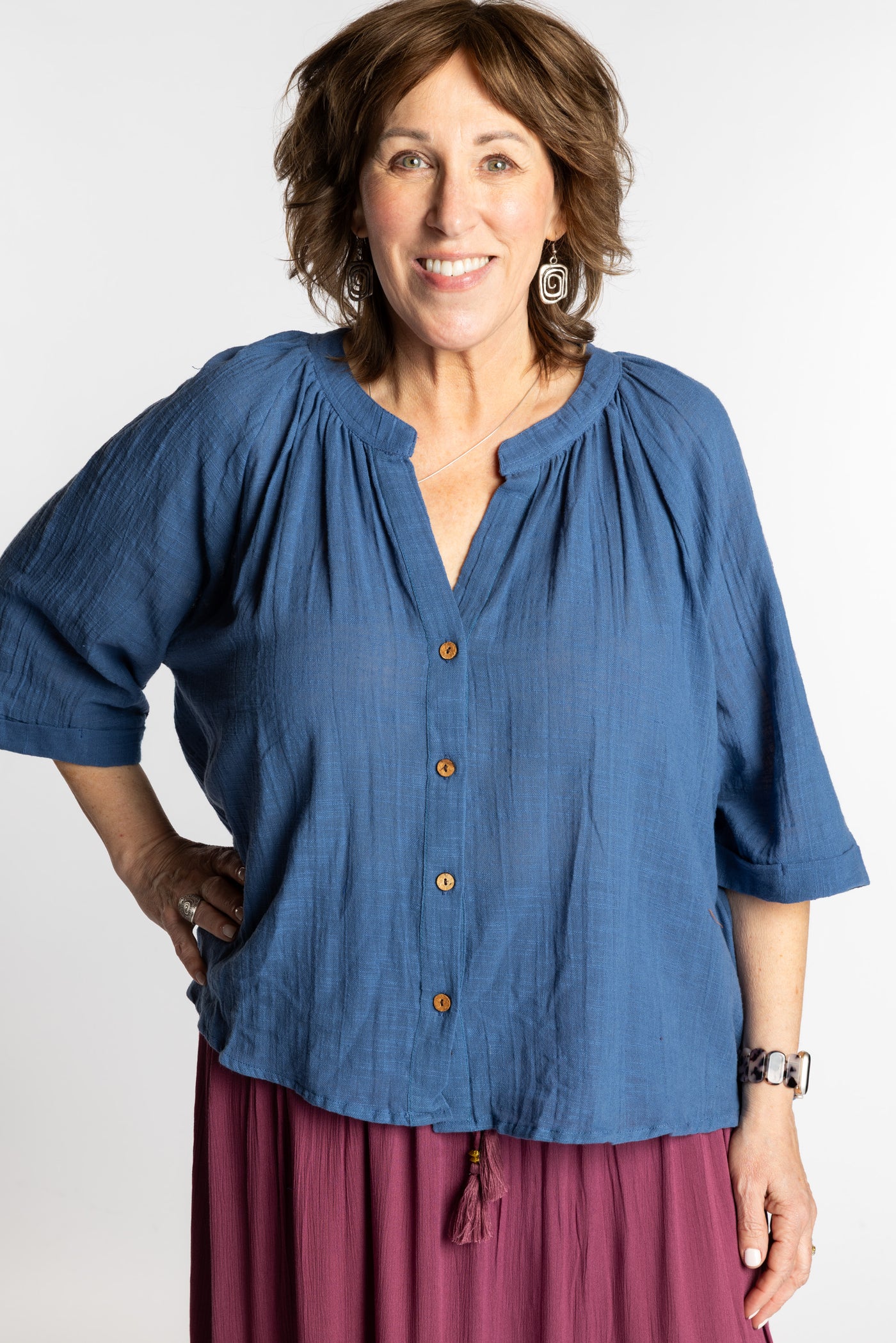 Betty is wearing the L/XL blue flowy boho cotton top