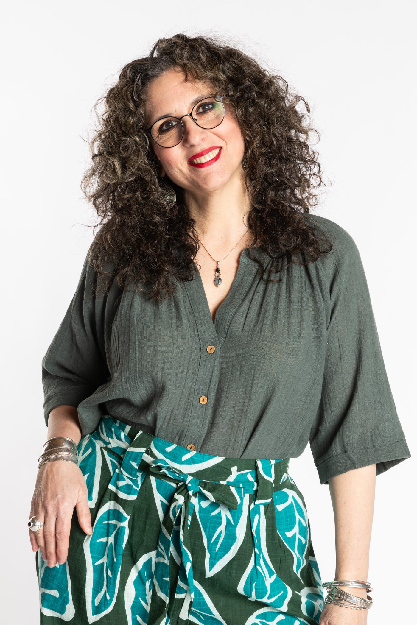 Susan is wearing the L/XL green sage flowy boho cotton top