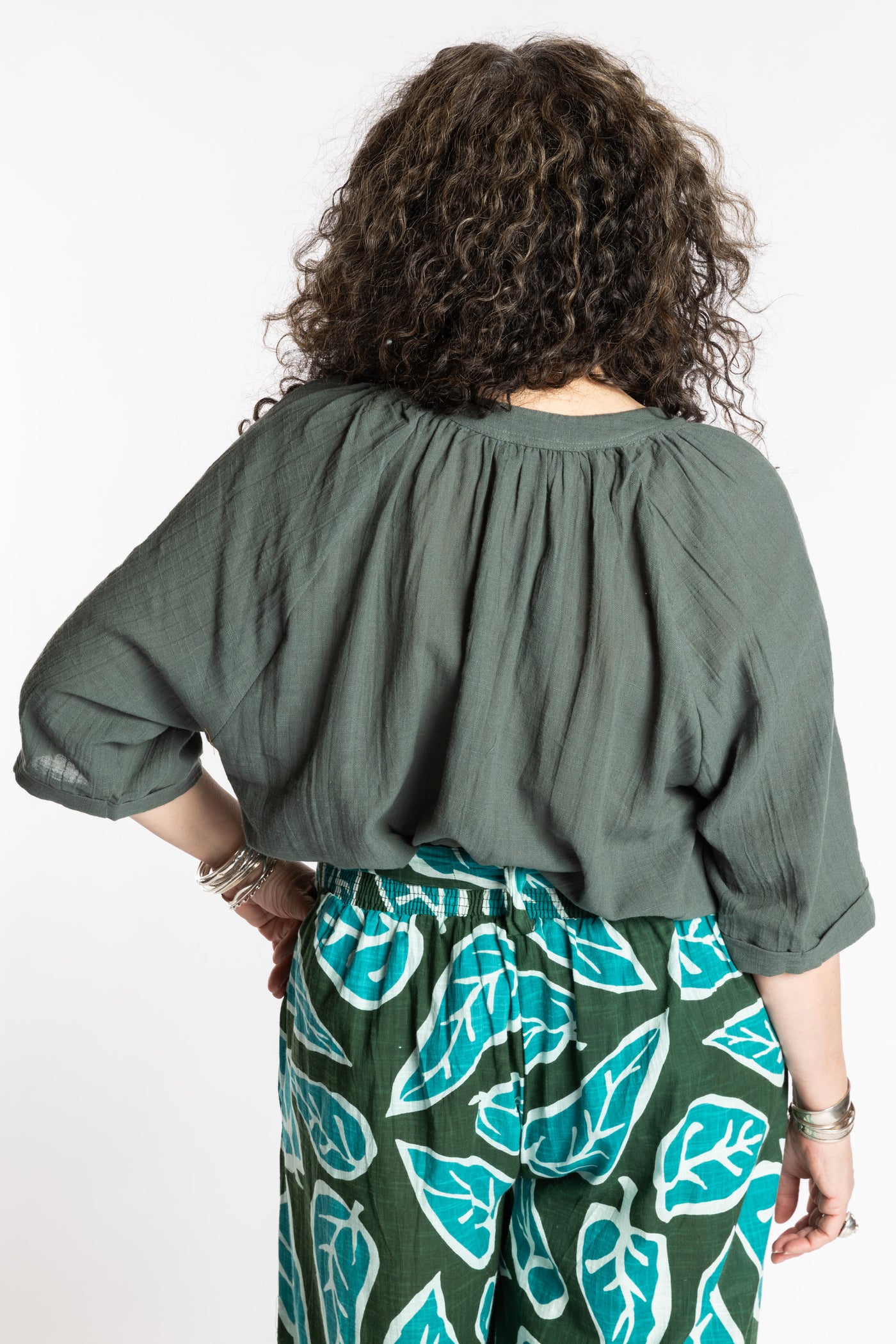 Susan is wearing the L/XL green sage flowy boho cotton top
