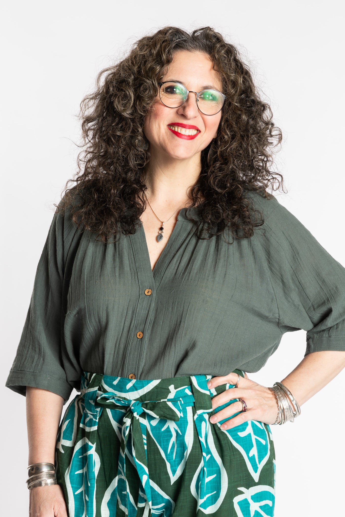 Susan is wearing the L/XL green sage flowy boho cotton top