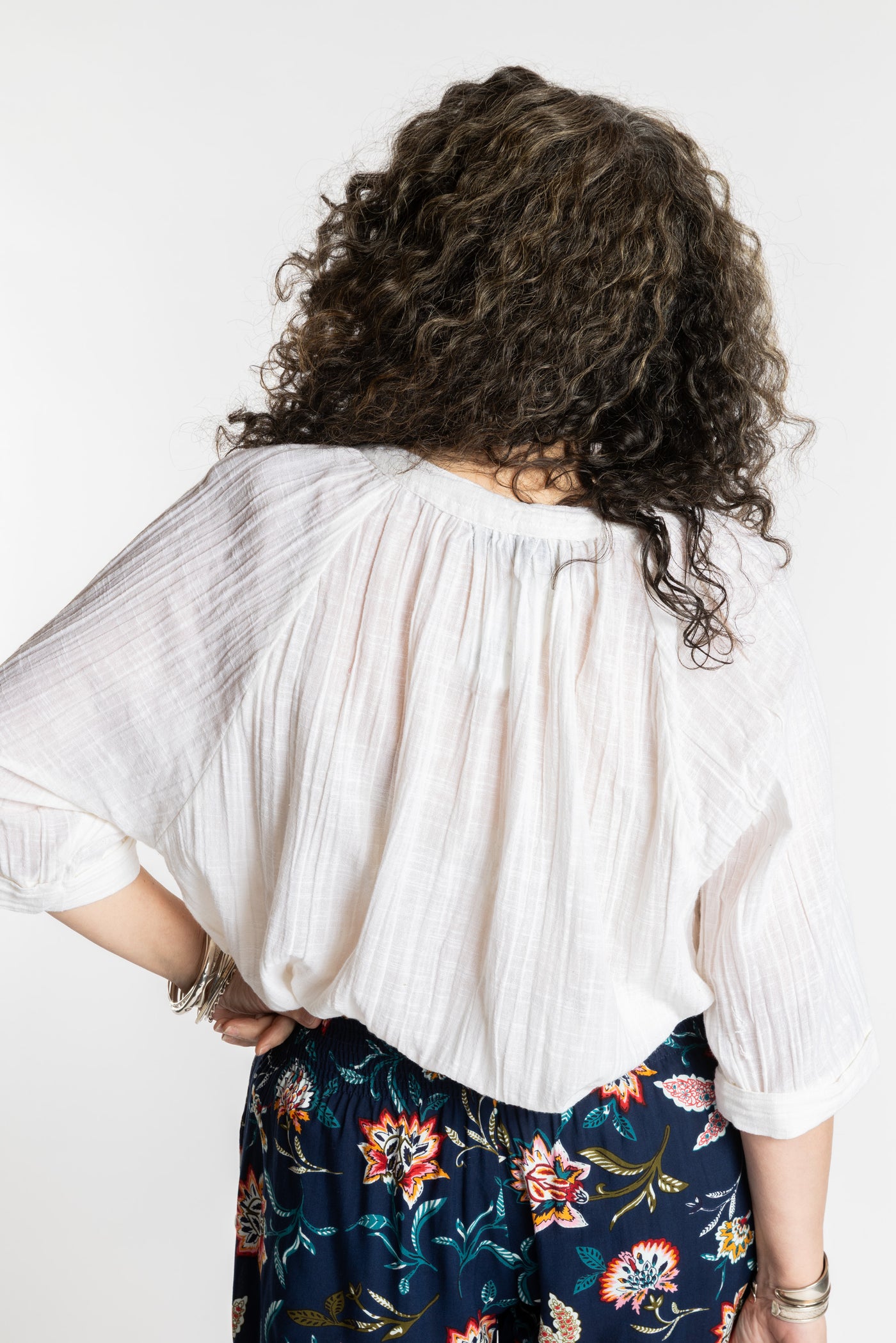 Susan is wearing the L/XL white flowy boho cotton top