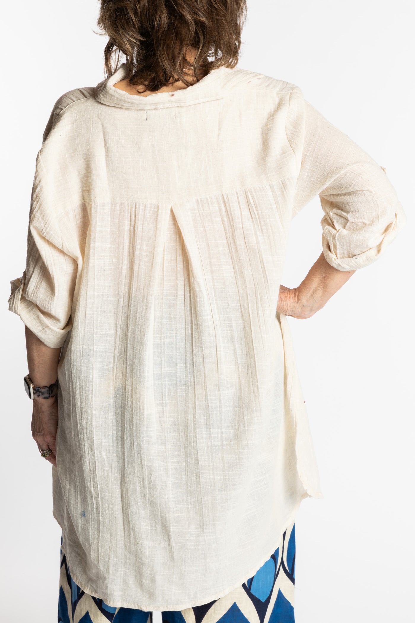 Betty is wearing the white Eggshell Long Boho Cotton Tunic