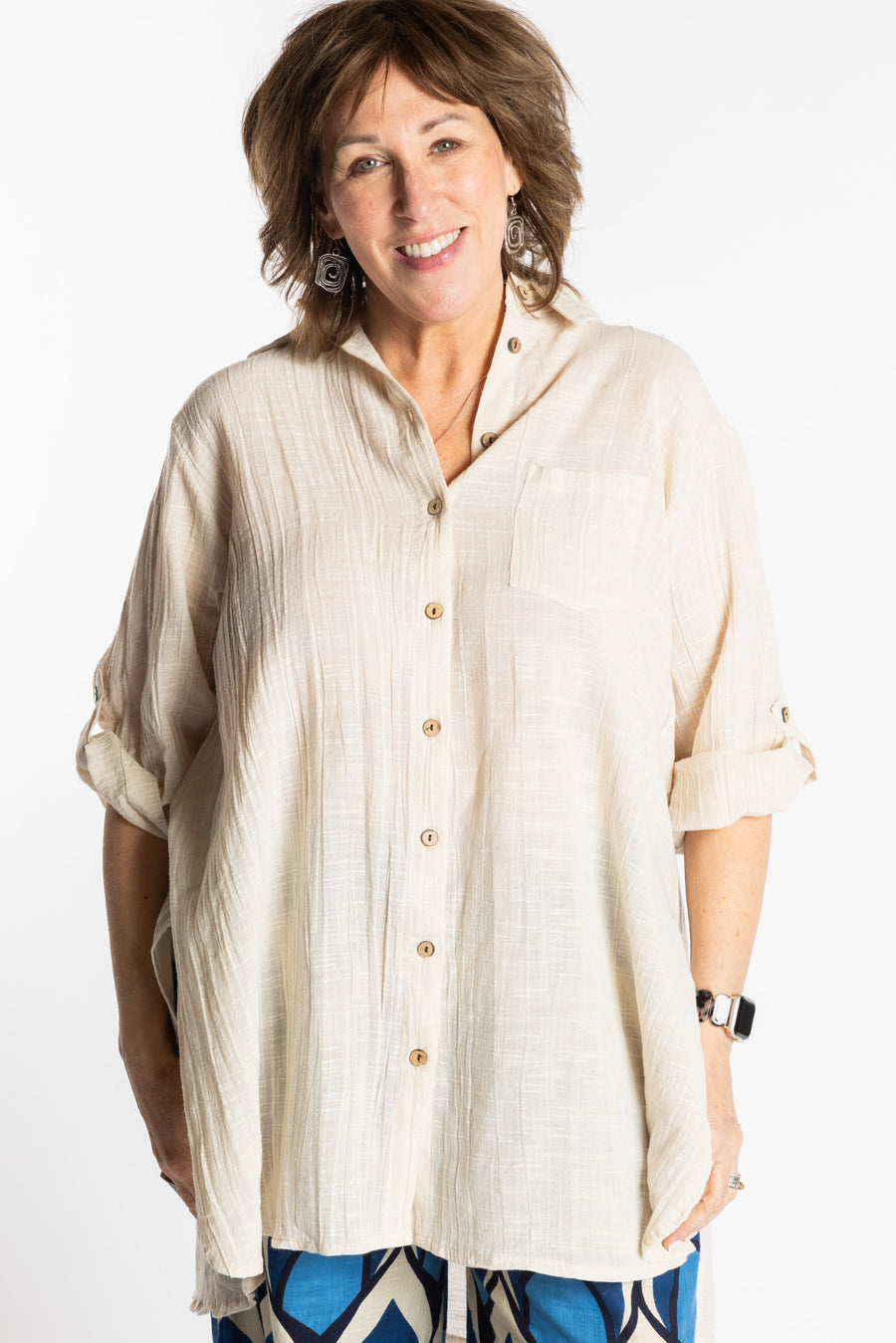 Betty is wearing the white Eggshell Long Boho Cotton Tunic