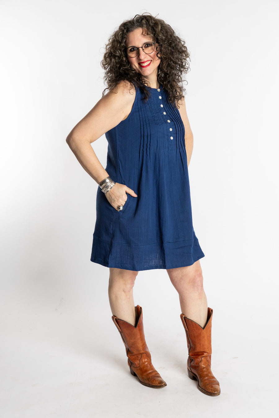 Susan is wearing the M/L navy bohemian cotton dress styled with boots
