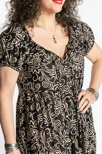 Susan is wearing the size M/L Black Amara Cotton Maxi Dress