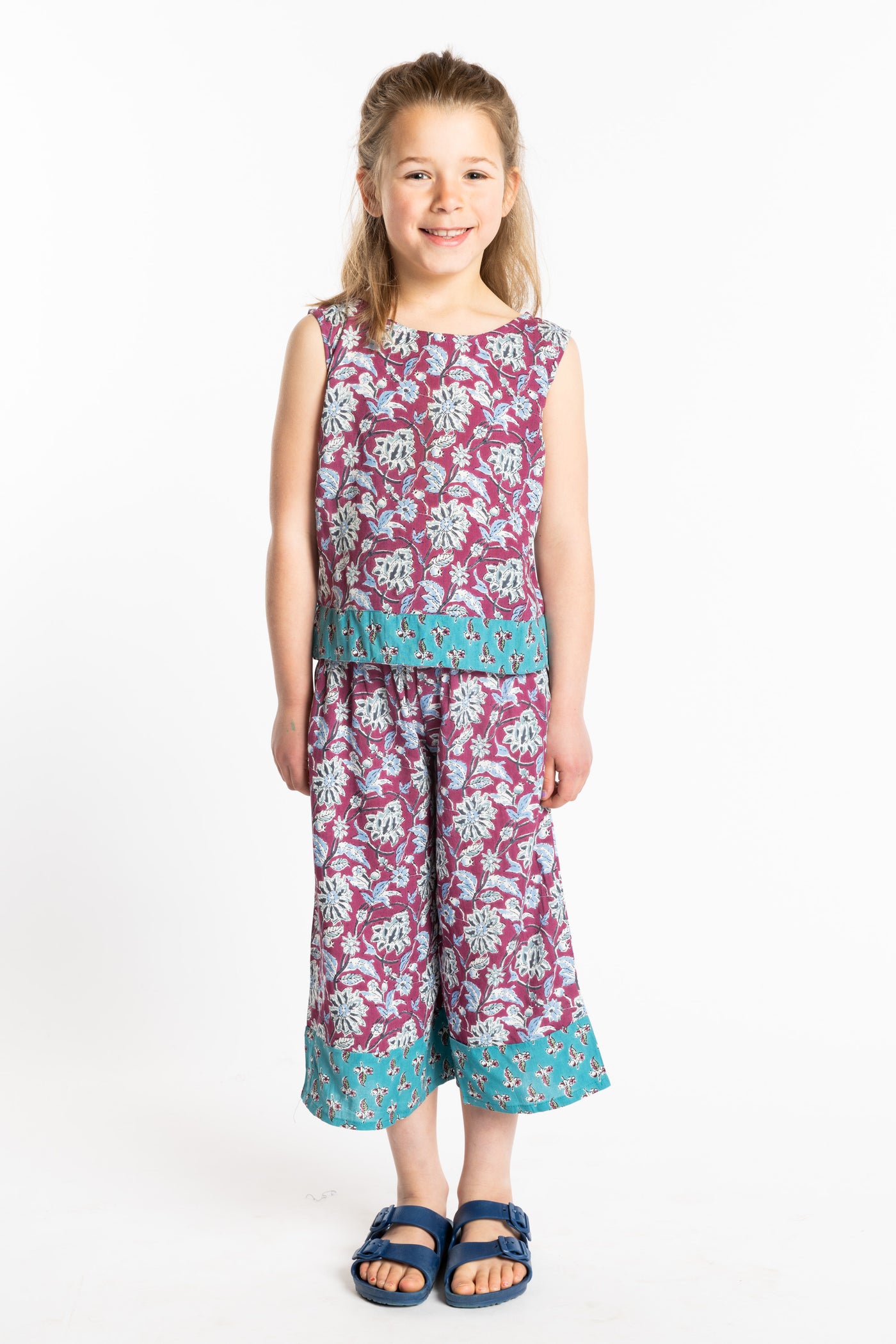 Louisa wearing the Sahana Contrast Hem Kids Top and Penny Lane Contrast Hem Kids Pants in burgundy floral print, size Small