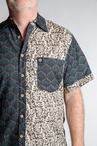 Chris, 5'7", is wearing the Field Fusion Button Up in black floral print, size M