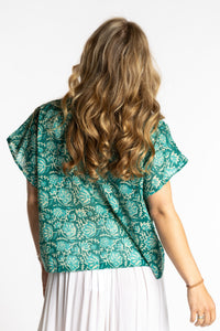 Susan is wearing the L/XL jade blue and green floral Screen Printed Cotton Blouse