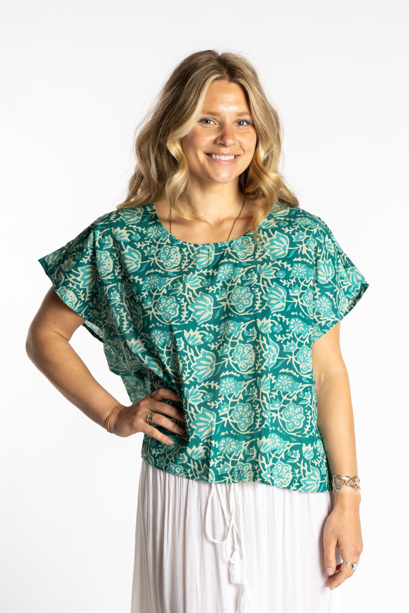Susan is wearing the L/XL jade blue and green floral Screen Printed Cotton Blouse