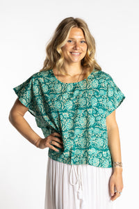 Susan is wearing the L/XL jade blue and green floral Screen Printed Cotton Blouse