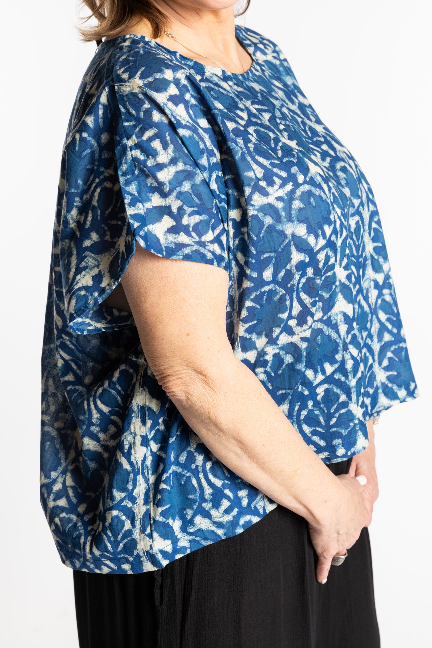 Betty is wearing the L/XL Blue floral Screen Printed Cotton Blouse