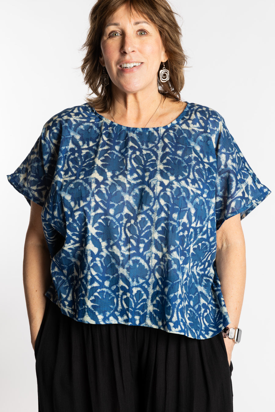 Betty is wearing the L/XL Blue floral Screen Printed Cotton Blouse