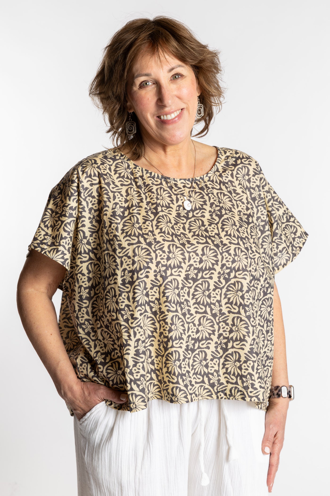 Betty is wearing the L/XL Gray floral Screen Printed Cotton Blouse