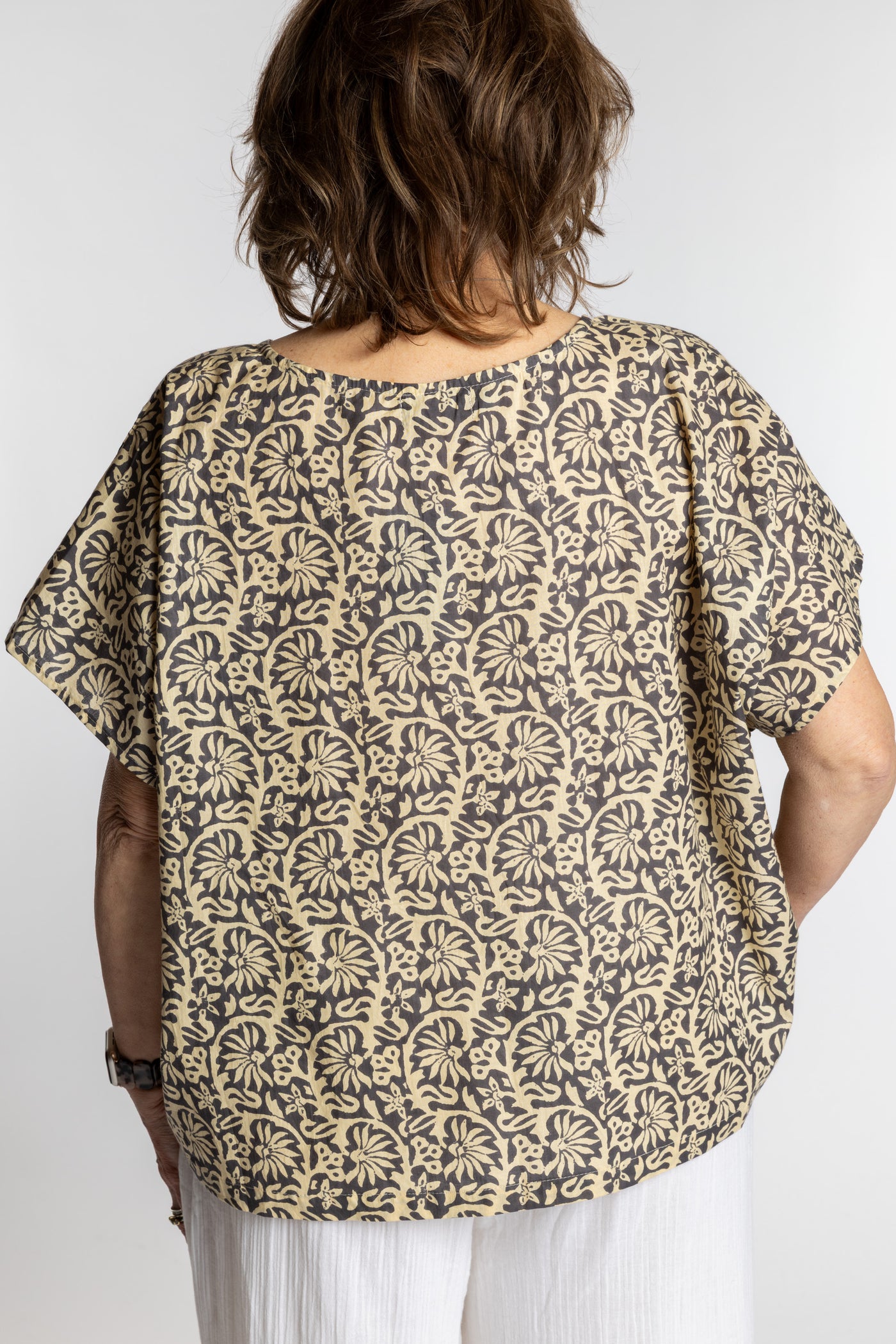 Betty is wearing the L/XL Gray floral Screen Printed Cotton Blouse