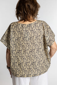Betty is wearing the L/XL Gray floral Screen Printed Cotton Blouse