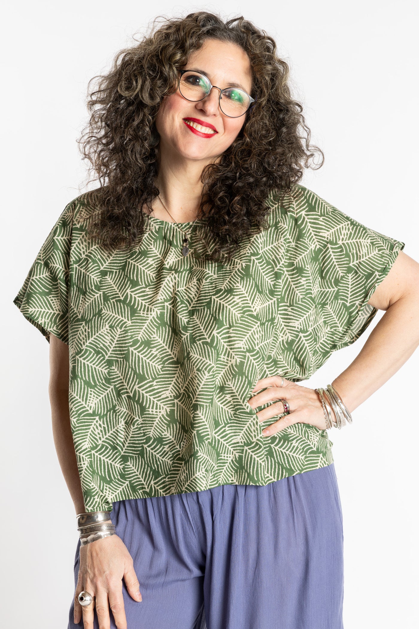 Susan is wearing the L/XL Fern green floral Screen Printed Cotton Blouse