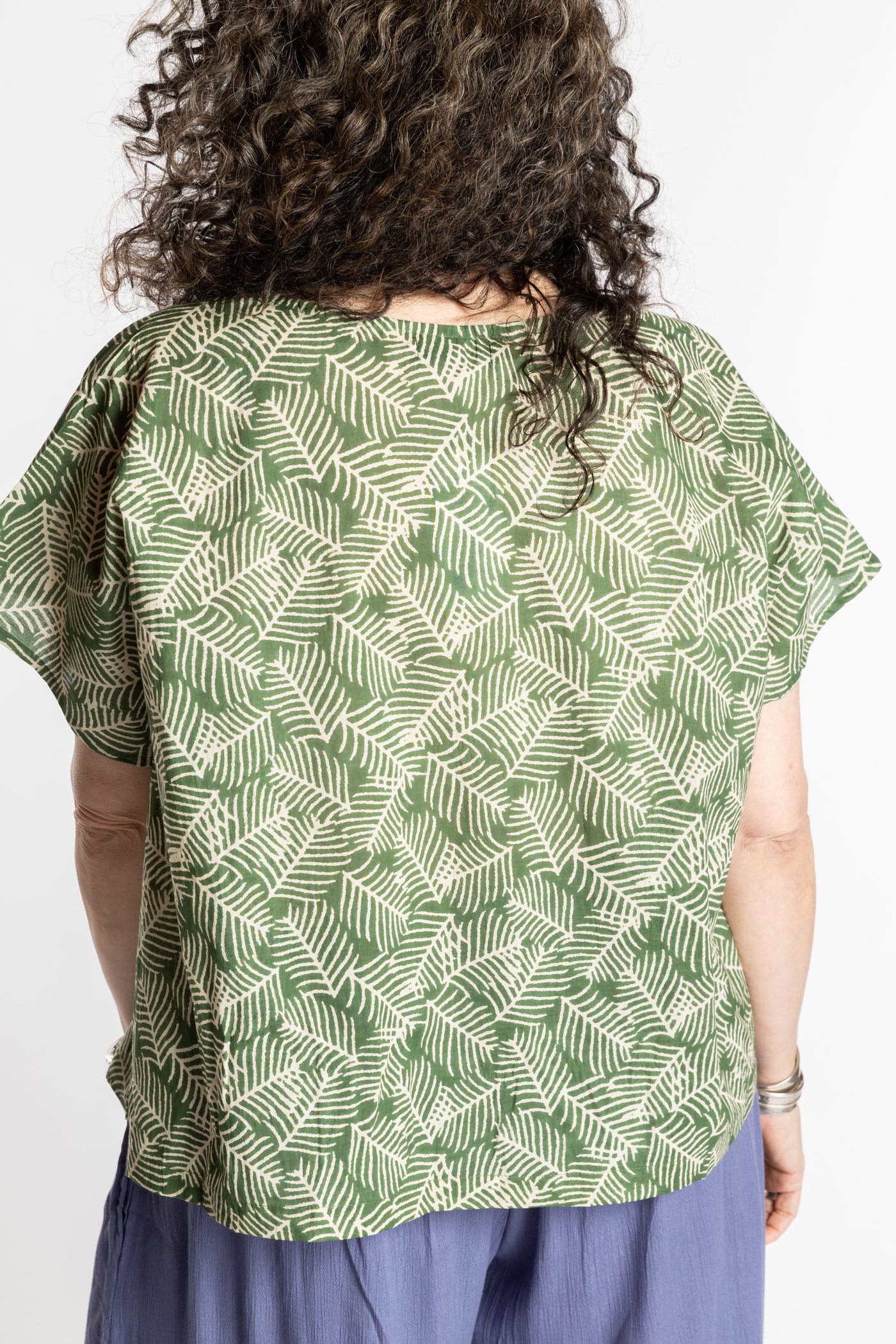 Susan is wearing the L/XL Fern green floral Screen Printed Cotton Blouse