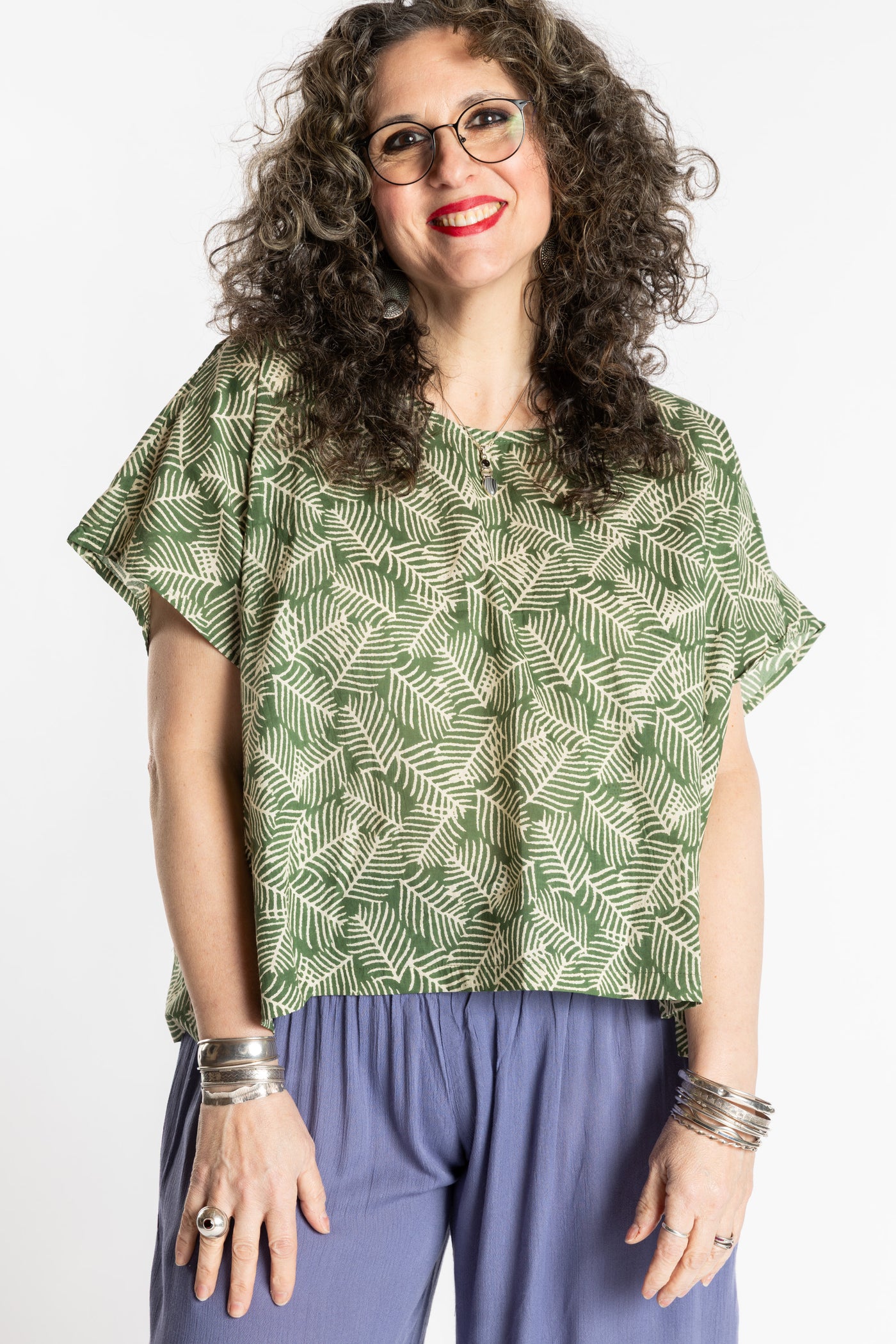 Susan is wearing the L/XL Fern green floral Screen Printed Cotton Blouse