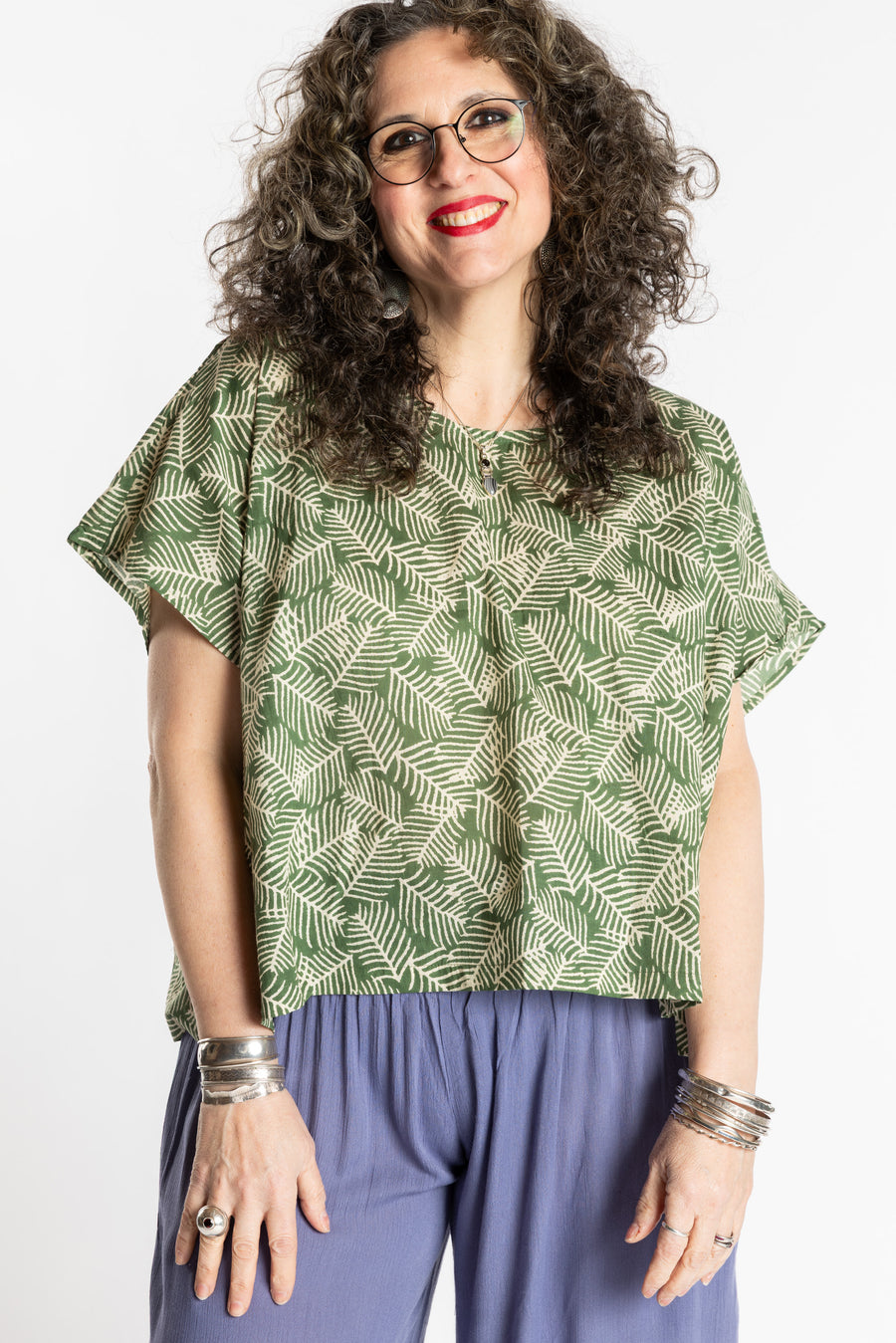 Susan is wearing the L/XL Fern green floral Screen Printed Cotton Blouse