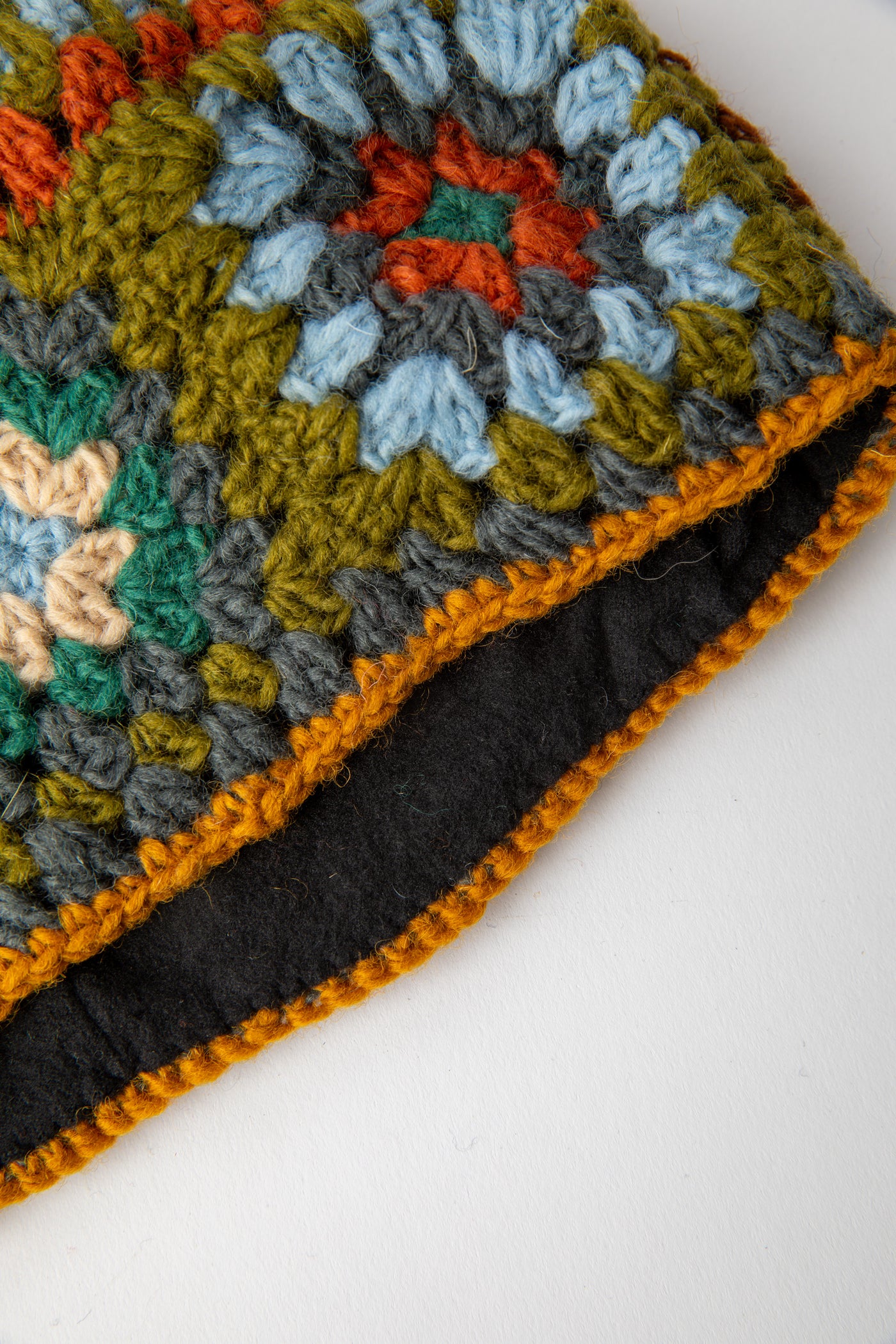 Granny Square Wool Pom Pom Hat in turquoise