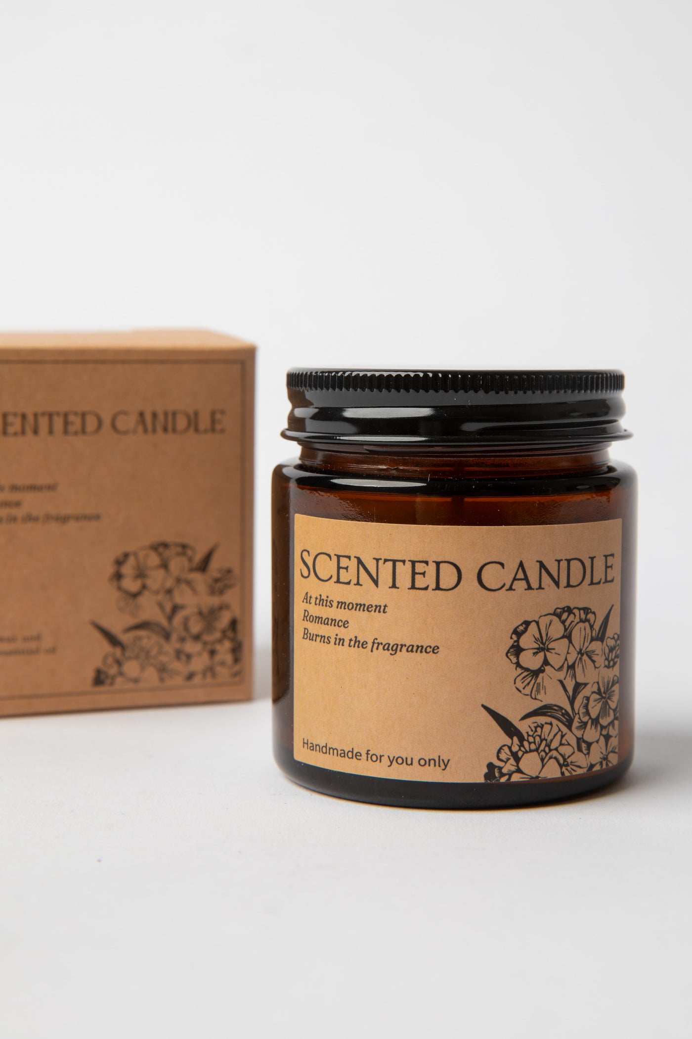 Hand-poured amber glass Apothecary Jar Candle beside kraft box with black lid