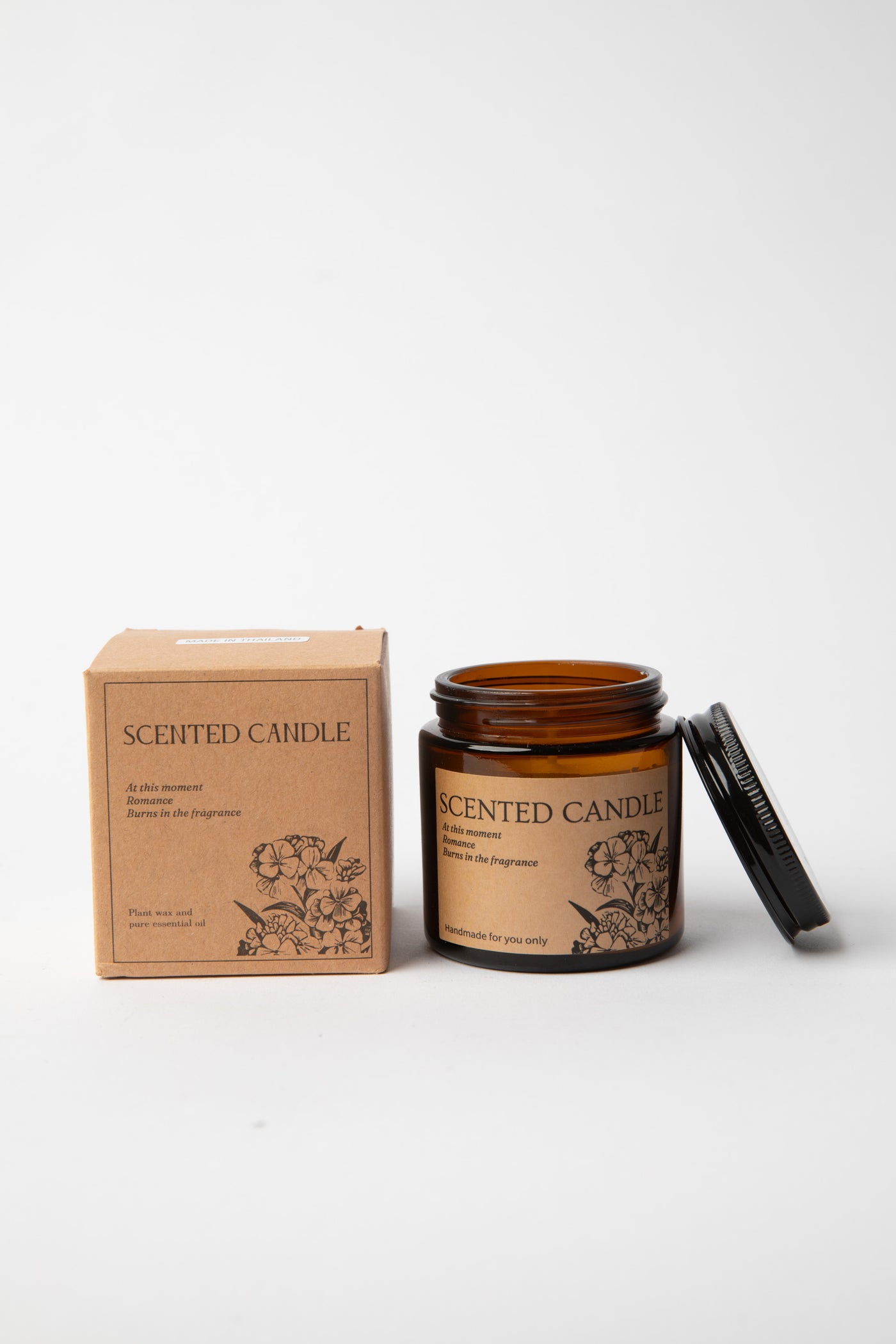 Hand-poured amber glass Apothecary Jar Candle beside kraft box with black lid