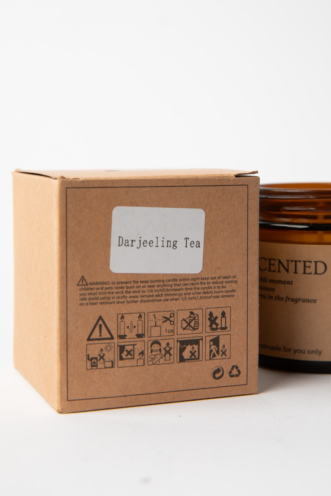 Darjeeling Tea Apothecary Jar Candle box label with candle partially visible
