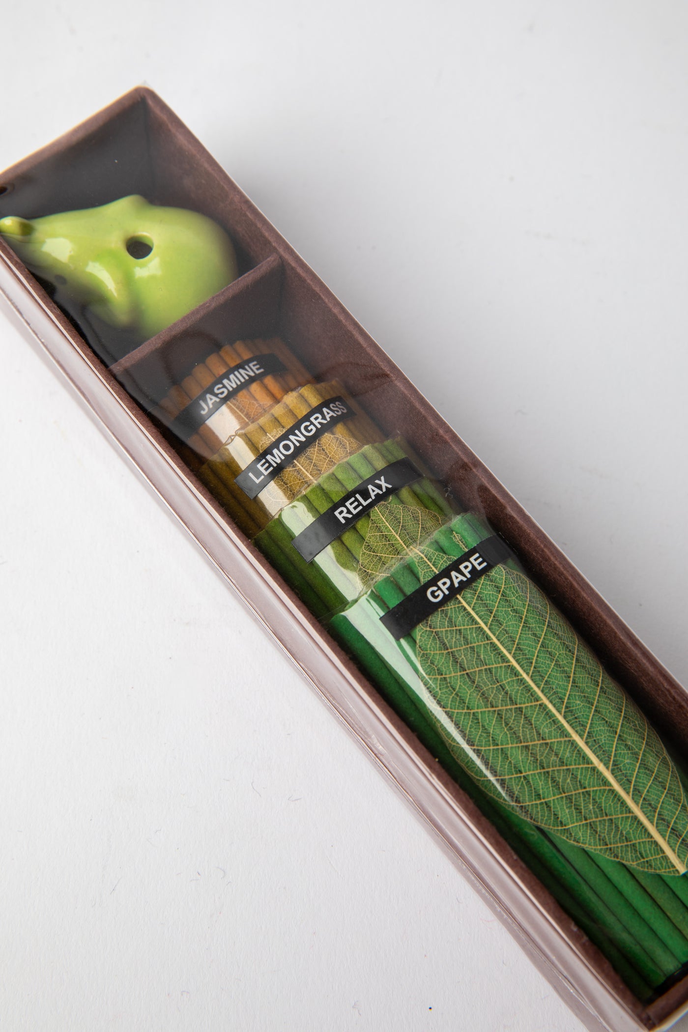 Green Elephant Incense Gift Set featuring ceramic holder and jasmine, lemongrass, and grape incense sticks