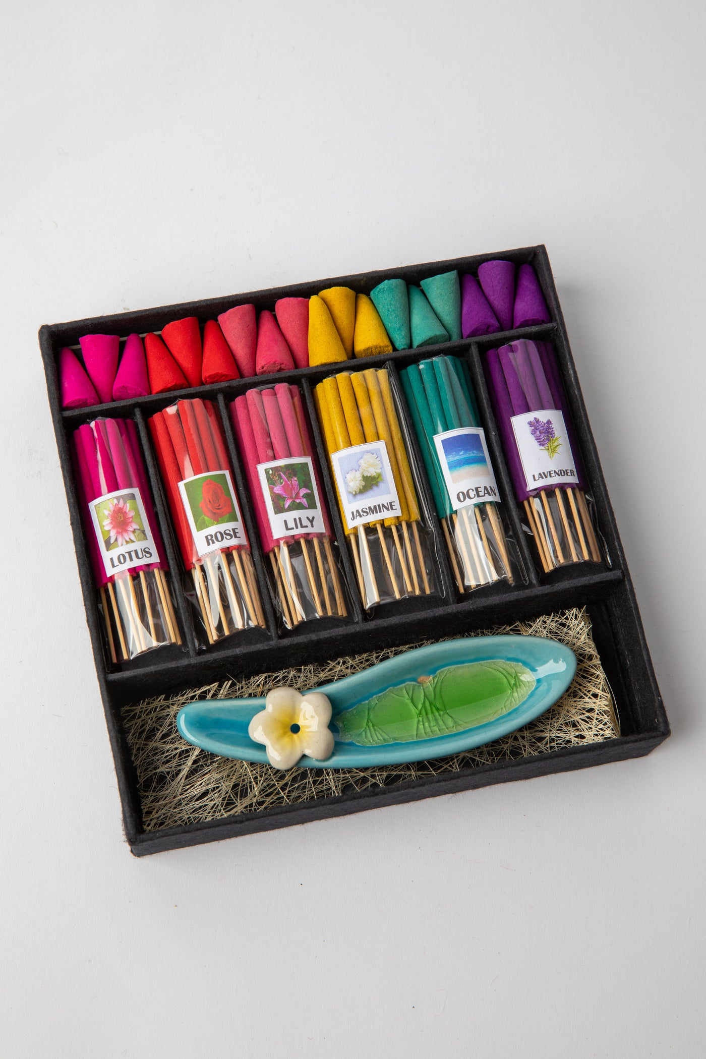 Rainbow Incense Gift Set featuring six bundles of incense sticks and cones with ceramic leaf-shaped incense burner