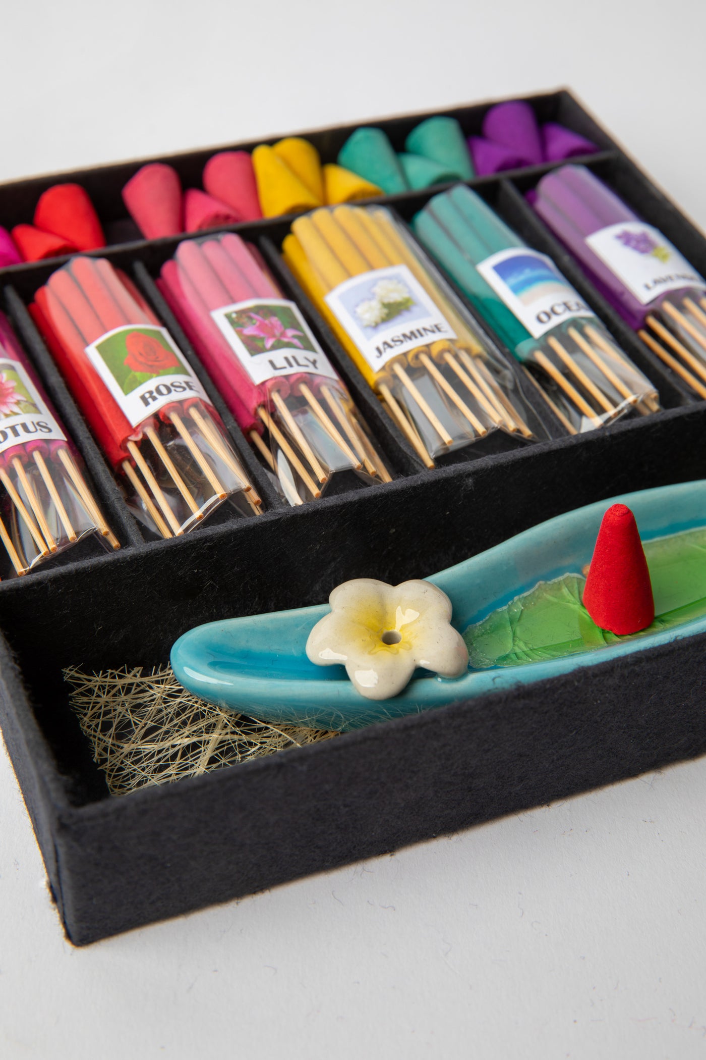 Aromatherapy gift set with colorful incense sticks, cones, and ceramic incense burner for home relaxation