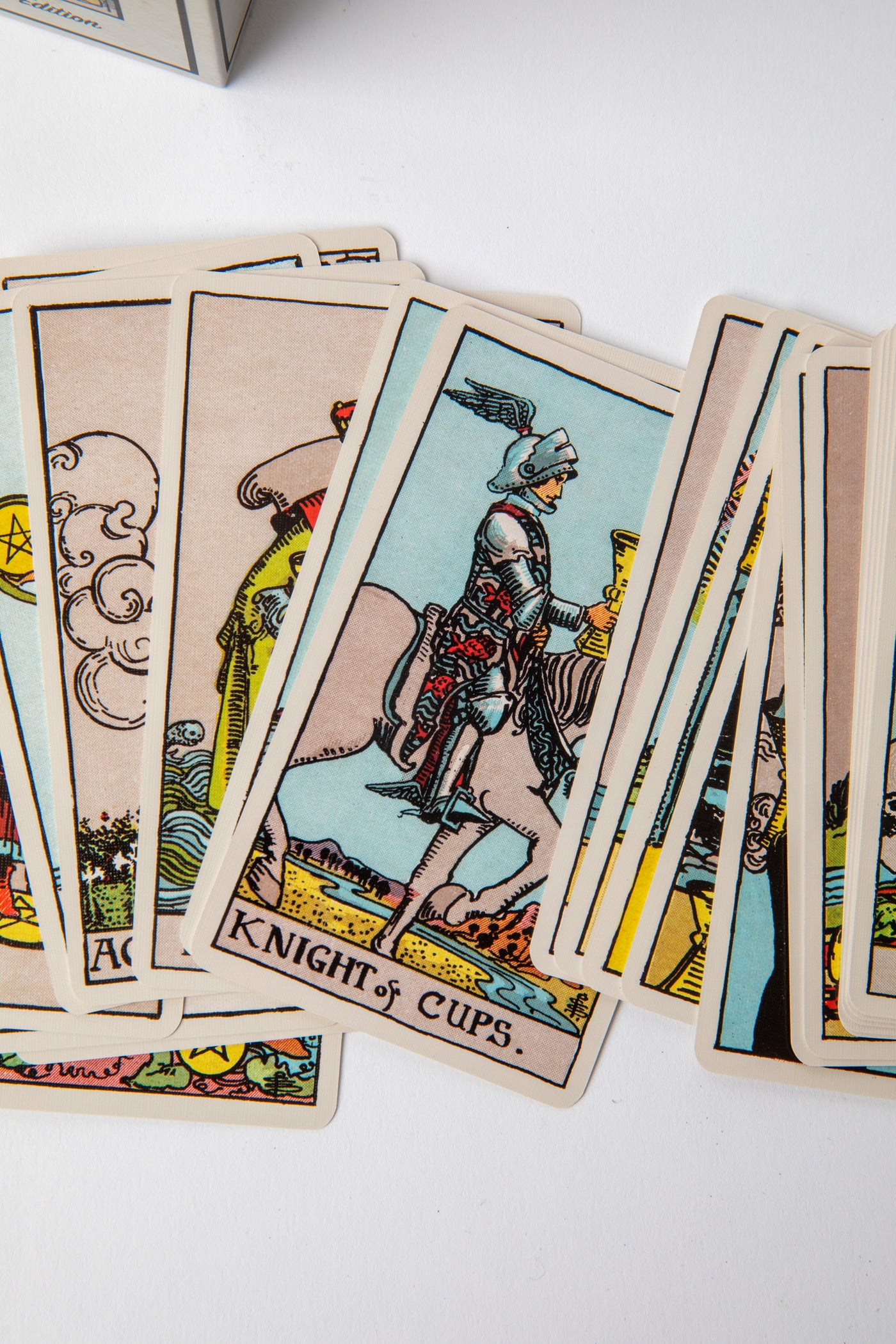 Close-up of Major Arcana cards from the Classic 1909 Tarot Deck highlighting The Fool, The Magician, and The High Priestess artwork