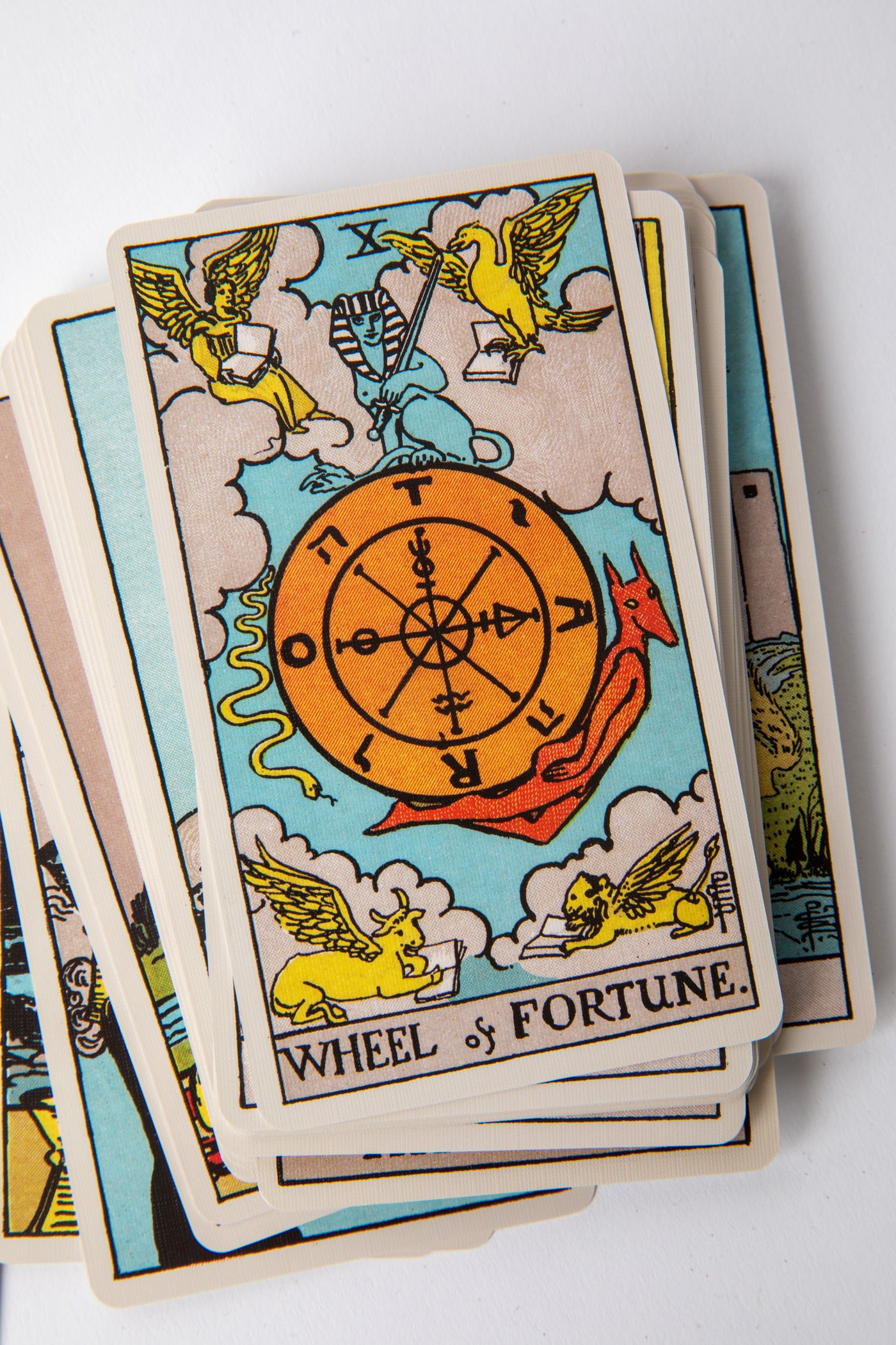 Close-up of Major Arcana cards from the Classic 1909 Tarot Deck highlighting The Fool, The Magician, and The High Priestess artwork