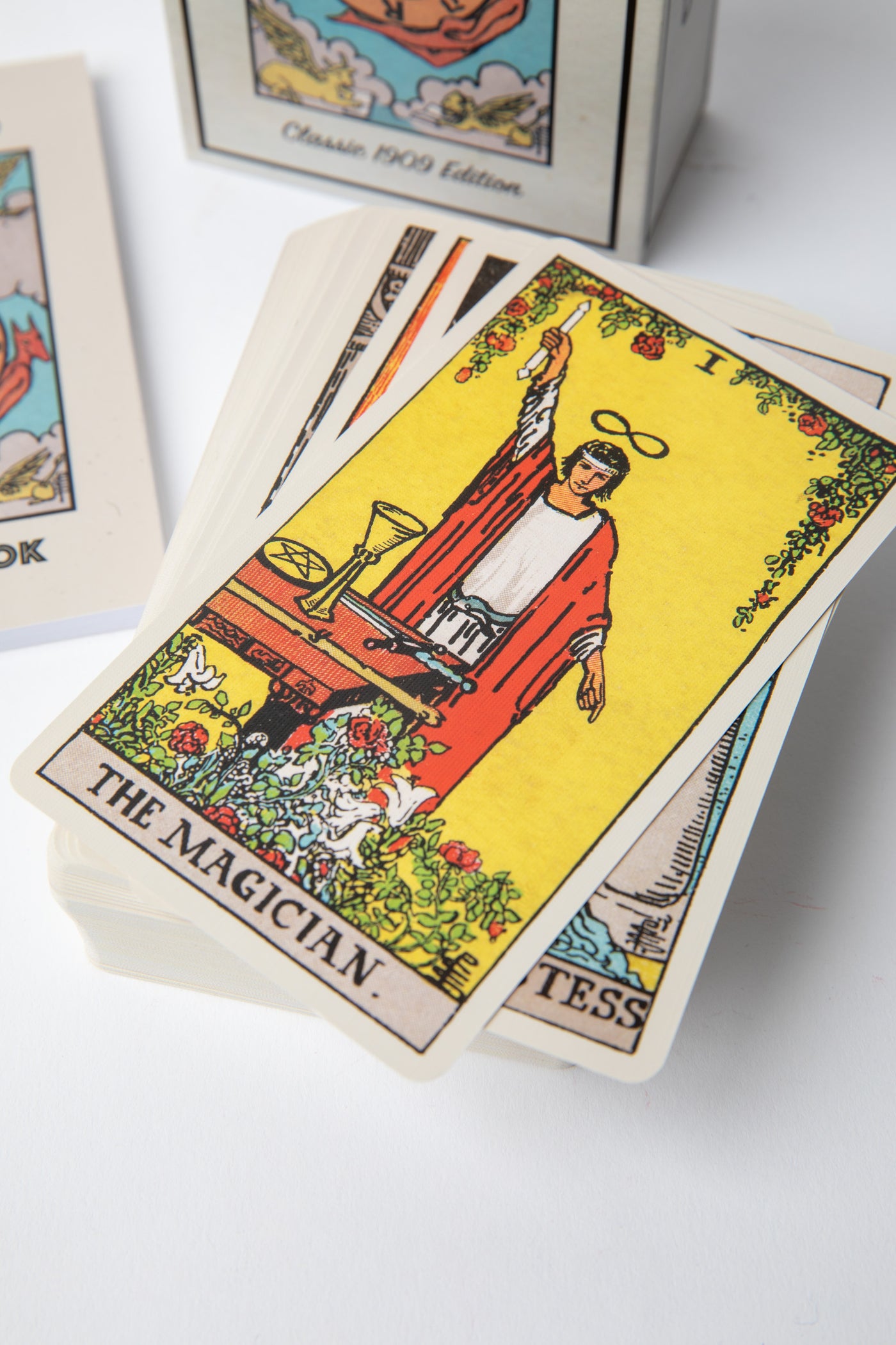 Close-up of Major Arcana cards from the Classic 1909 Tarot Deck highlighting The Fool, The Magician, and The High Priestess artwork