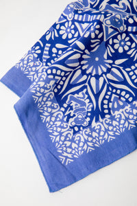 Folded blue Grateful Dead bandana with white Dancing Bears and mandala details on cotton fabric